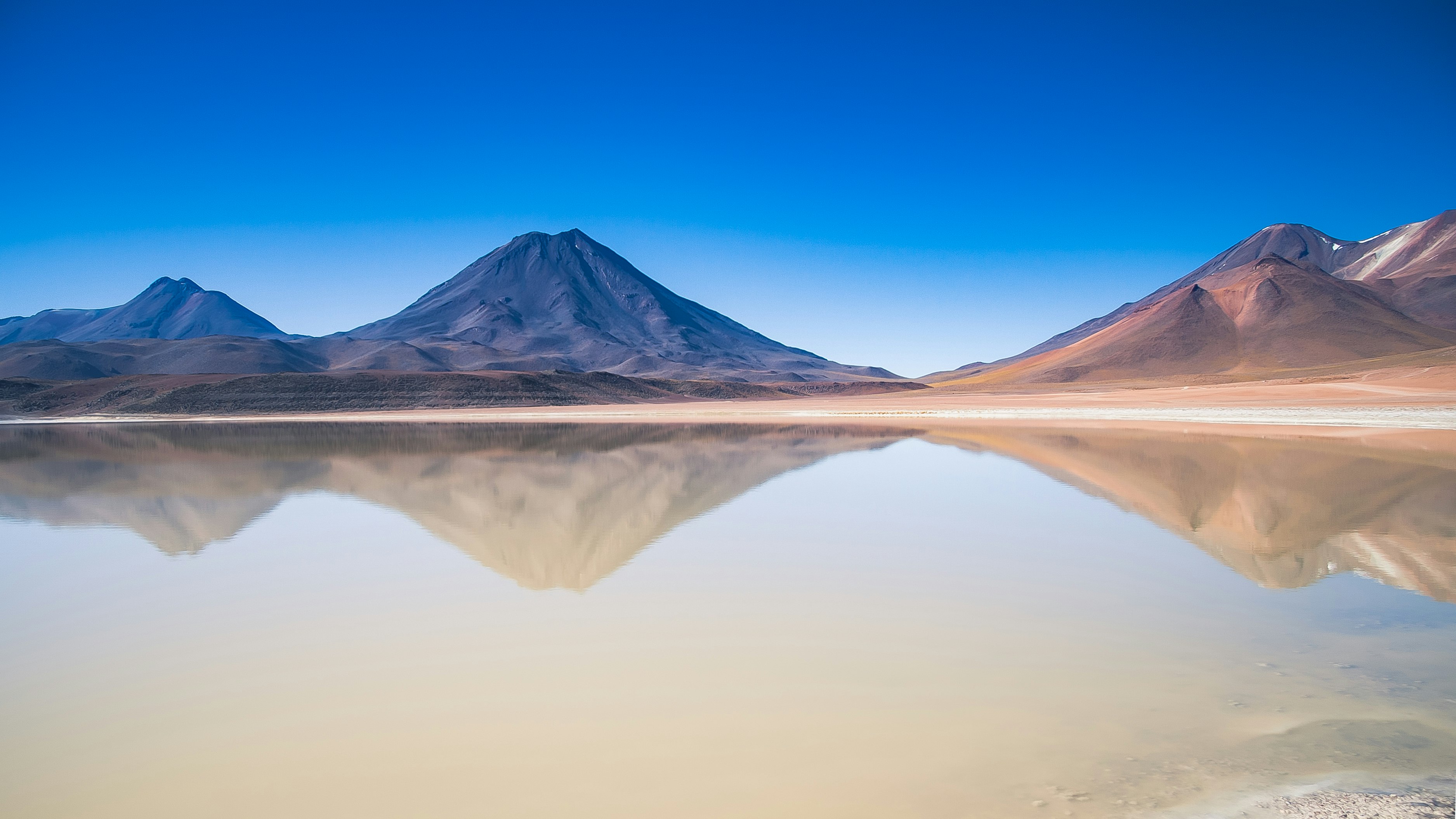 mountains reflected on water